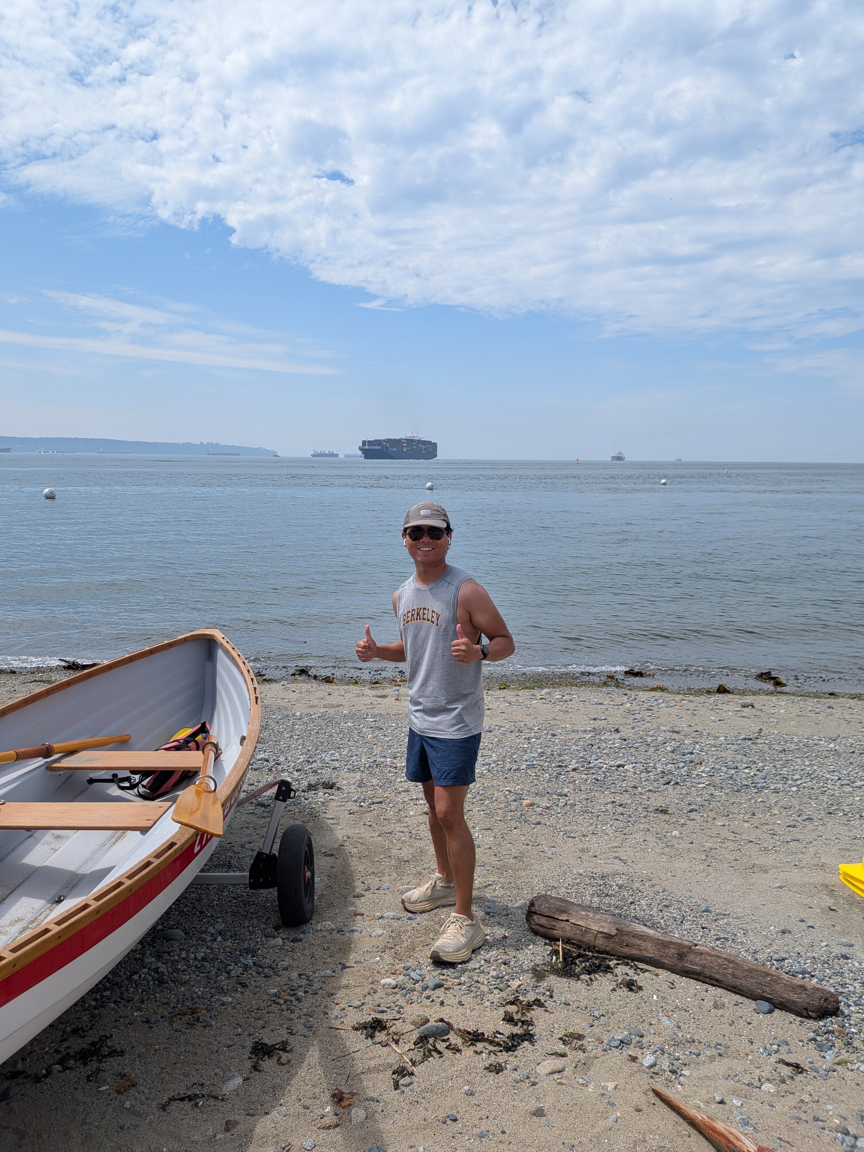 Nikolai at the beach in a Berkeley shirt